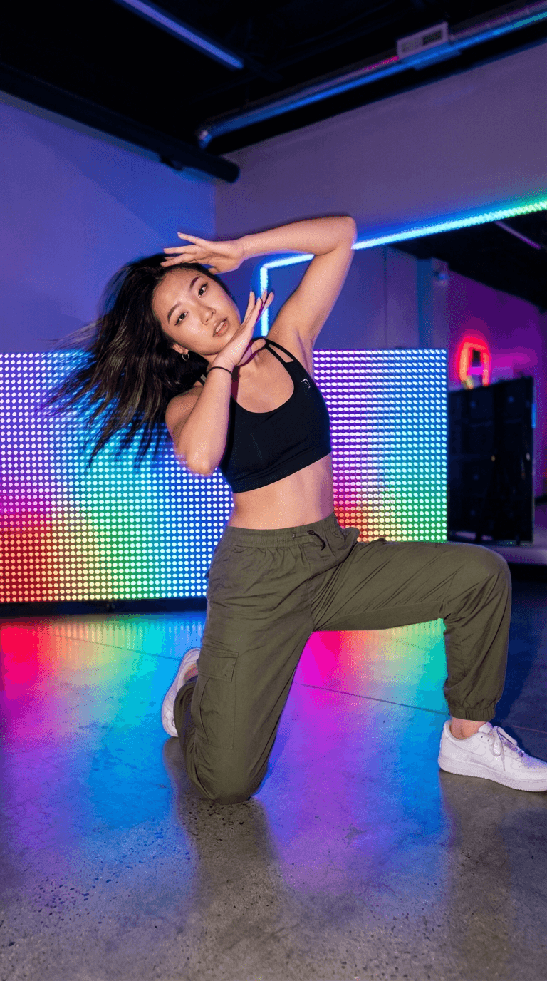 Dynamic TikTok dance with neon lights and motion blur